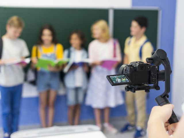 Group of kids being recorded
